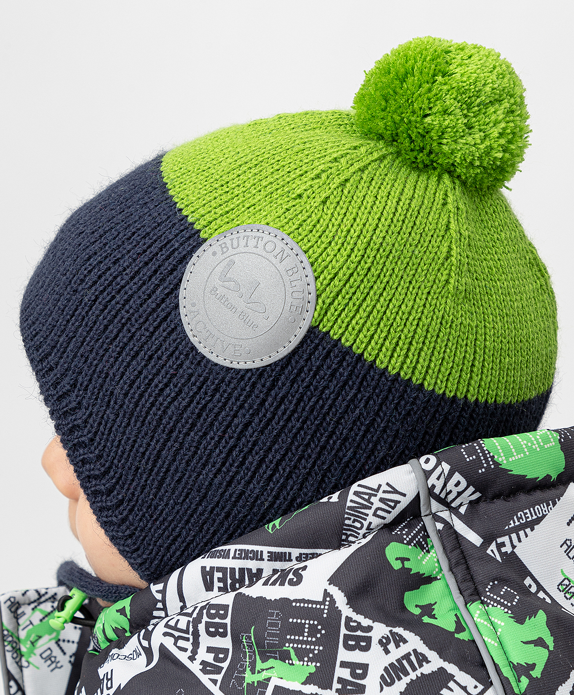 Шапка вязаная на флисовой подкладке с завязками и помпоном салатовая Button Blue